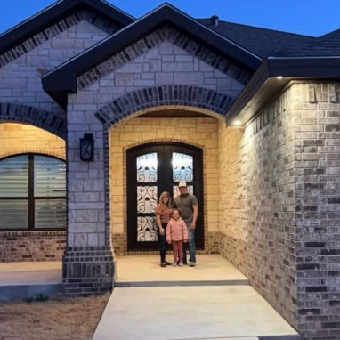 happy family moving into new home